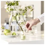 شمع معطر با ظرف شیشه‌ای، رنگ بژ ، رایحه وانیل IKEA LÖVSKOGSLUND - Image 5